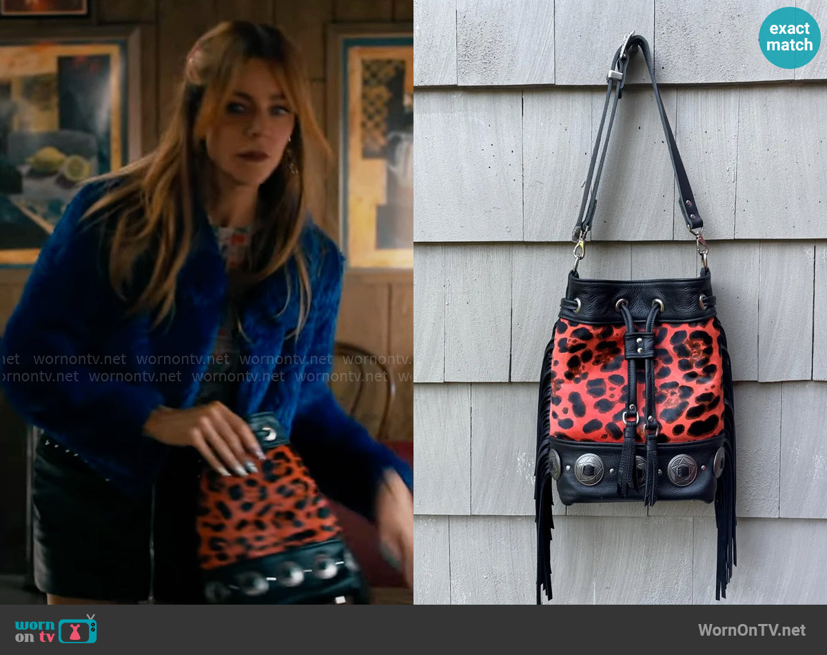 Of The Sun Leather Wild West x Wild Thing Bucket Bag worn by Morgan Gillory (Kaitlin Olson) on High Potential