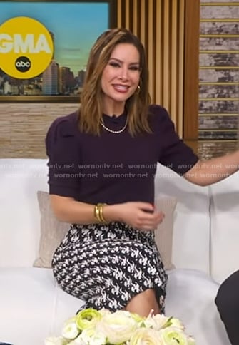 Rebecca’s purple puff sleeve sweater and printed skirt on Good Morning America
