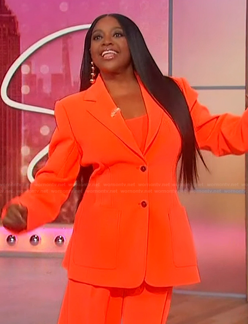 Sherri’s orange blazer and pants on Sherri