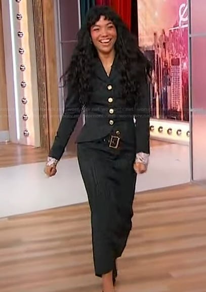 Silvia Dionicio’s black blazer and skirt on Sherri