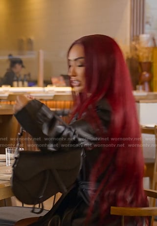Bre’s black shoulder bag on Selling Sunset