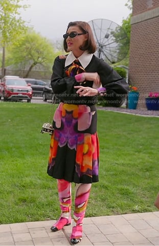Bronwyn’s black floral tie neck blouse and skirt on The Real Housewives of Salt Lake City