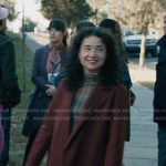 Marissa’s plaid mesh top and burgundy coat on Elsbeth