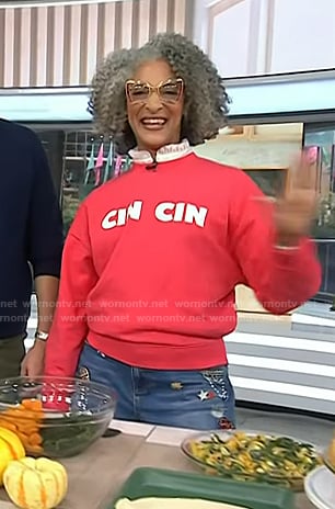 Carla Hall’s red Cin Cin Sweatshirt and embellished jeans on Today