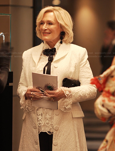 Dina’s white jacquard pleated coat on Alls Fair