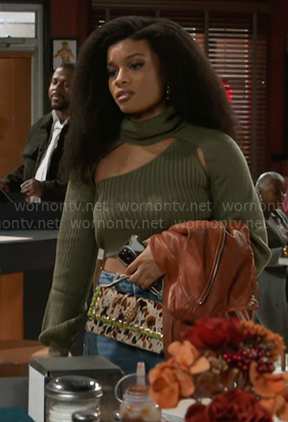 Eva’s green cropped cutout sweater and cow bag on Beyond the Gates