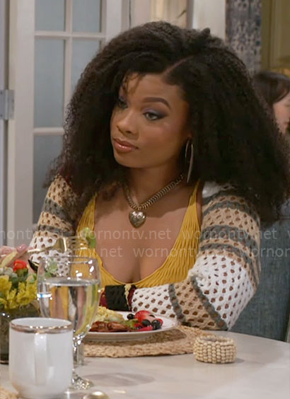 Eva’s yellow textured tank top and crochet shrug sweater on Beyond the Gates