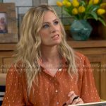 Gemma’s orange dot print blouse on The Neighborhood
