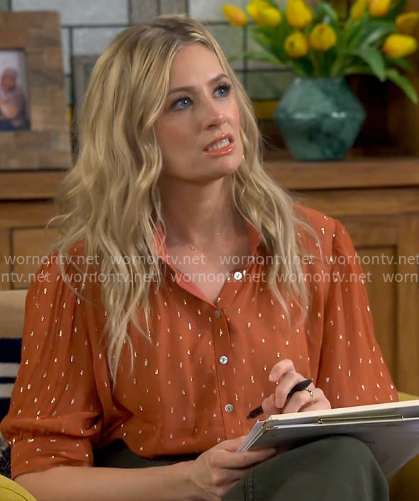 Gemma’s orange dot print blouse on The Neighborhood