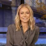 Kelly’s black printed tie neck blouse on Live with Kelly and Mark
