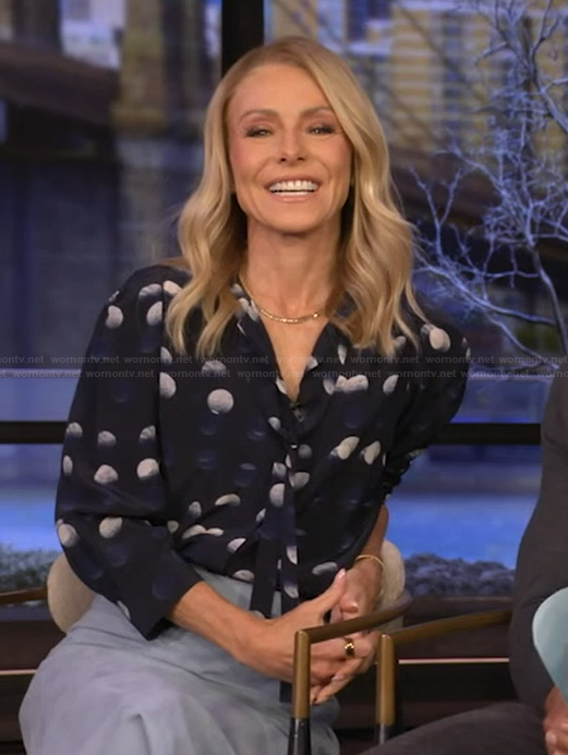Kelly’s navy dotted tie neck blouse on Live with Kelly and Mark