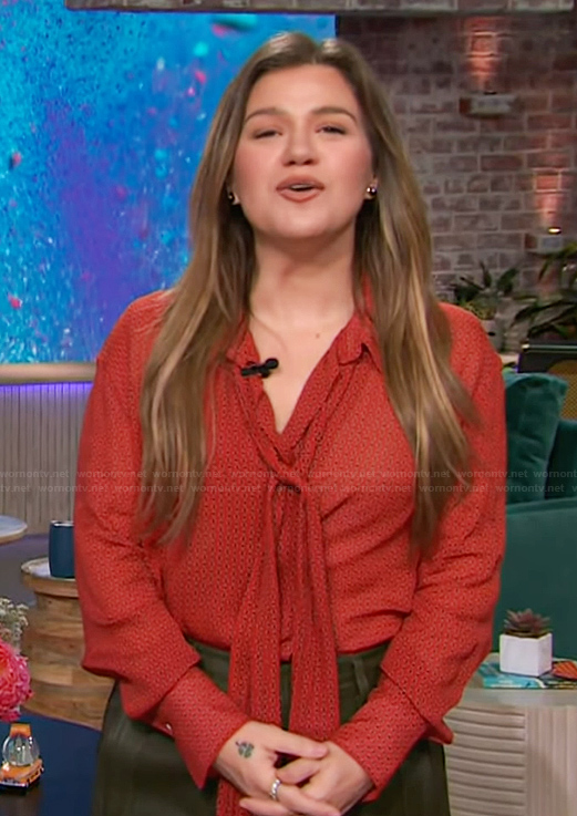 Kelly’s red printed tie neck blouse on The Kelly Clarkson Show