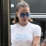 Khloe’s white cropped tee and sunglasses on The Kardashians