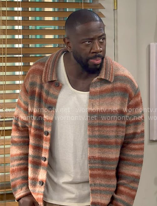 Malcolm’s coral striped overshirt on The Neighborhood