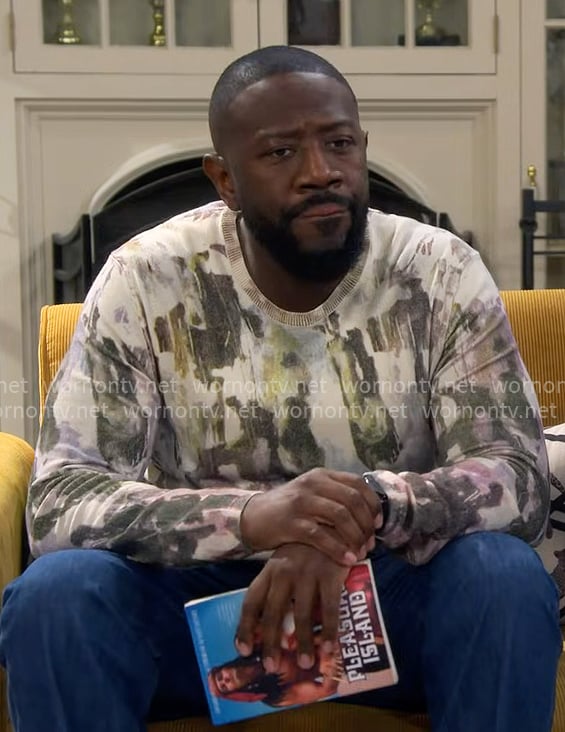 Malcolm’s painted print sweater on The Neighborhood