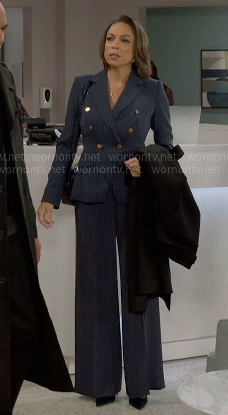Nicole’s navy pinstripe suit on Beyond the Gates