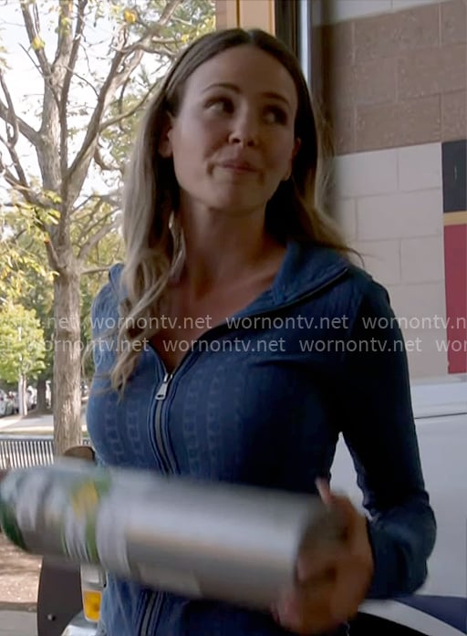 Novak’s blue cable-knit zip up sweater on Chicago Fire