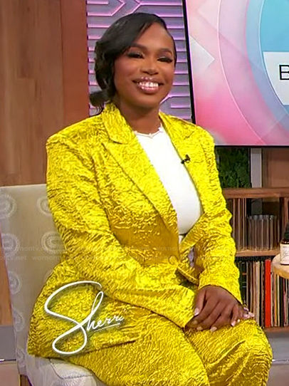 Shaina’s yellow shiny blazer and pants on Sherri