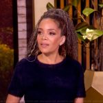 Sunny’s navy cashmere top and skirt on The View