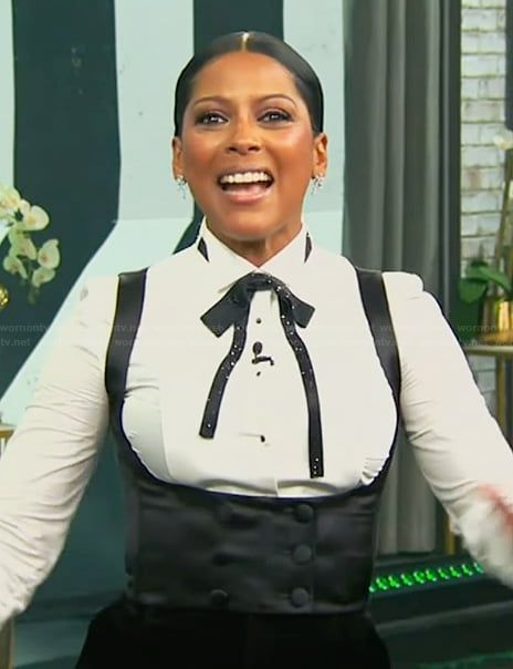 Tamron’s white tuxedo blouse and vest on Tamron Hall Show