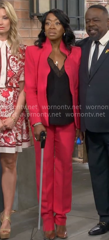 Tina’s red ruffled suit on The Neighborhood
