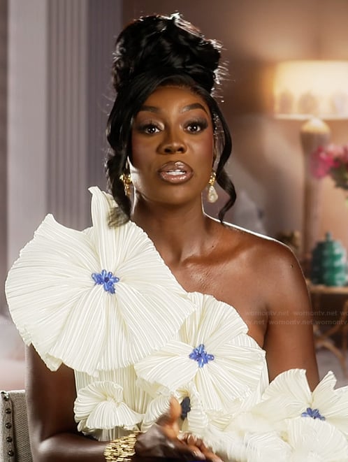 Wendy’s floral off shoulder confessional dress on The Real Housewives of Potomac