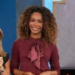 Zuri’s burgundy bow cardigan on Access Hollywood