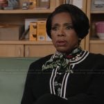 Barbara’s black floral print tie neck blouse on Abbott Elementary