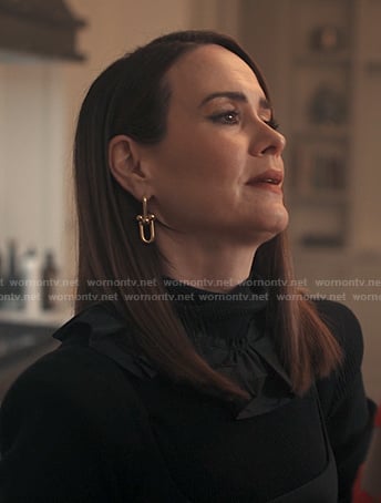 Carr’s gold link drop earrings on Alls Fair