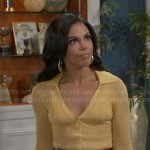 Dani’s yellow ribbed polo top and leather skirt on Beyond the Gates