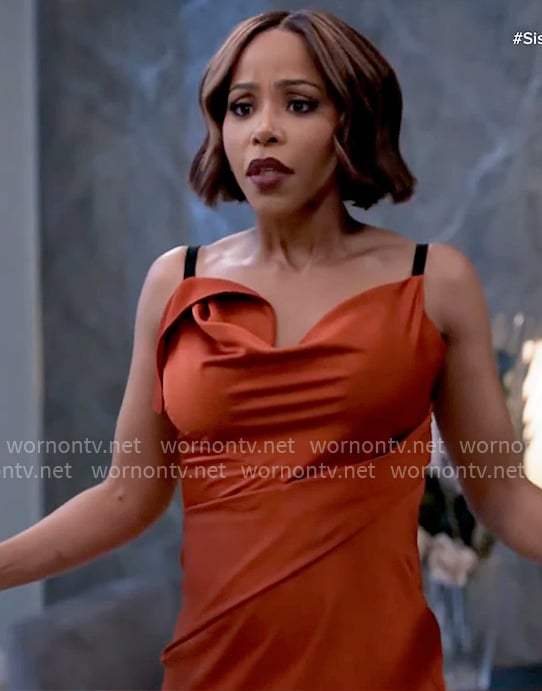 Dani’s rust red dress with black straps on Tyler Perrys Sistas