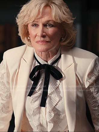 Dina’s white ruffle blouse with velvet tie on Alls Fair