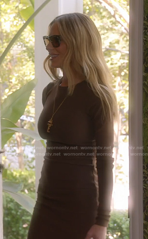 Dorit’s brown knit dress and white pumps on The Real Housewives of Beverly Hills
