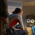 El’s white high cut sneakers on Stranger Things