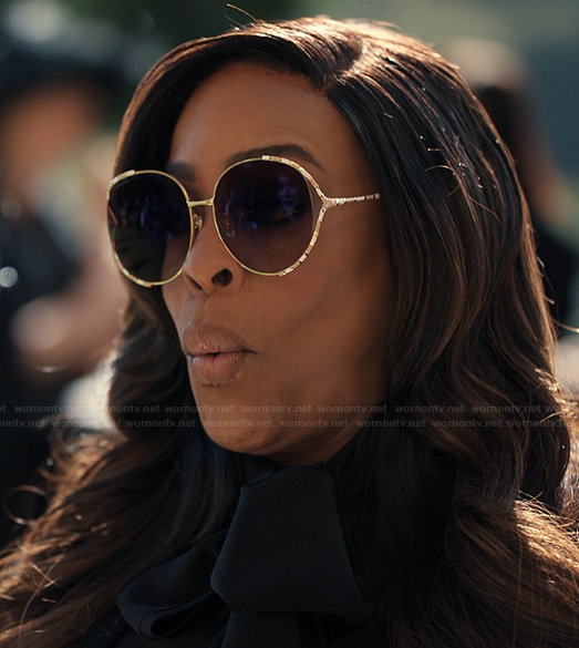 Emerald’s round trim sunglasses on Alls Fair
