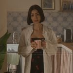 Emily’s black cherry print mini dress on Emily in Paris