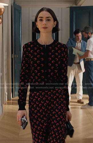 Emily’s black and red moon print cardigan and skirt on Emily in Paris