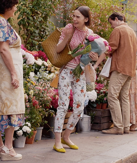 Emily’s floral print pants and yellow flats on Emily in Paris