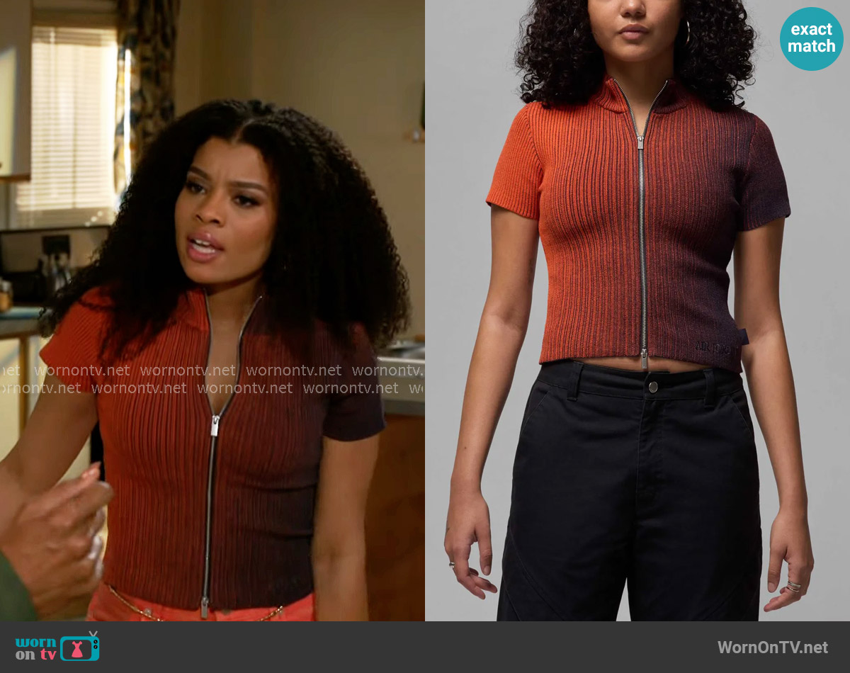 Jordan Short Sleeve Zip Cardigan in Cave Purple/ Mantra Orange worn by Eva Thomas (Ambyr Michelle) on Beyond the Gates