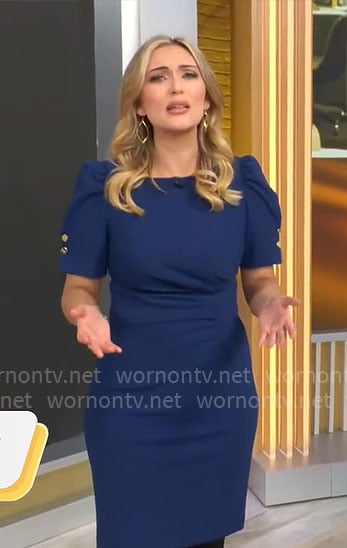 Kelly O’Grady’s dark blue puff-sleeve dress on CBS Mornings