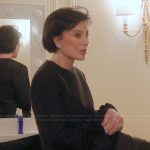 Kris’s black floral sleeve top on The Kardashians