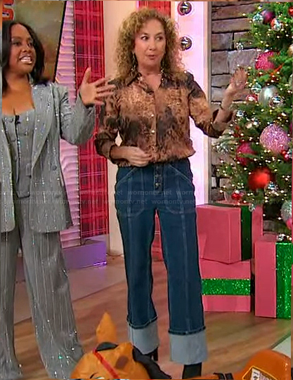 Laurie Schacht’s leopard print blouse and jeans on Sherri
