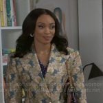Madison’s long floral coat on Beyond the Gates