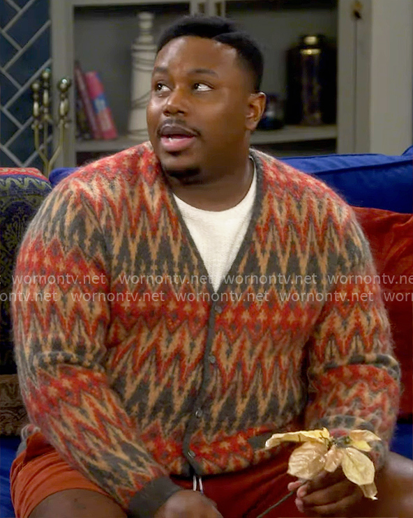 Marty’s orange chevron print cardigan on The Neighborhood
