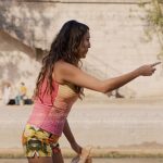 Mindy’s striped top and fruits print shorts on Emily in Paris