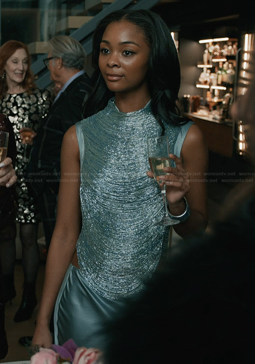 Nabria’s metallic drape top on Elsbeth