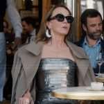 Sylvie’s silver metallic dress and sunglasses on Emily in Paris
