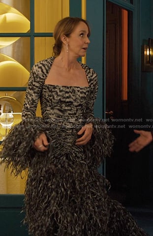 Sylvie’s print feather trim dress on Emily in Paris