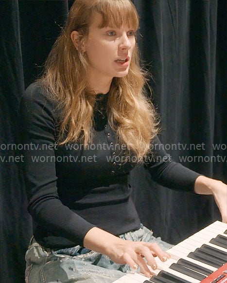 Taylor Swift’s black henley top and distressed jeans on The End of an Era