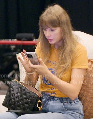 Taylor Swift’s orange kitty tee on The End of an Era